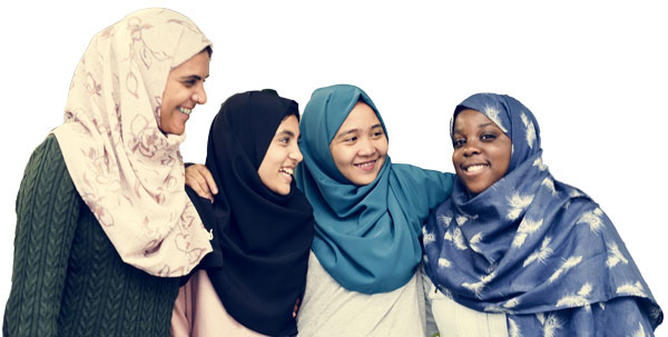 Photo of four young women smiling in hijab